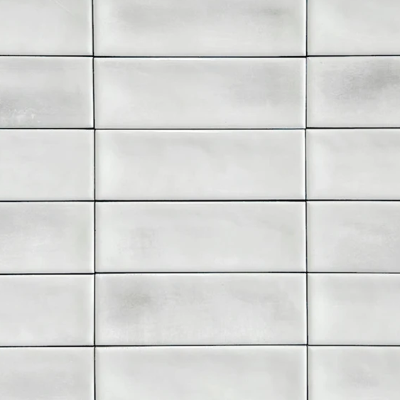 Close up of Atelier white brick wall and floor brick shaped tile