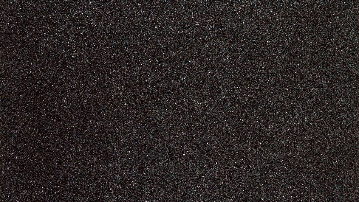 Close up of Sparkle black 30x60 porcelain wall and floor tile featuring a shimmering sparkle effect