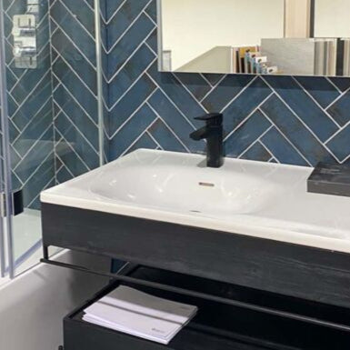 Wish blue gloss brick wall tile in a modern bathroom