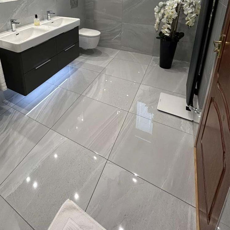 Stunning bathroom with walls and floors tiled with Andrea gloss dark grey tile