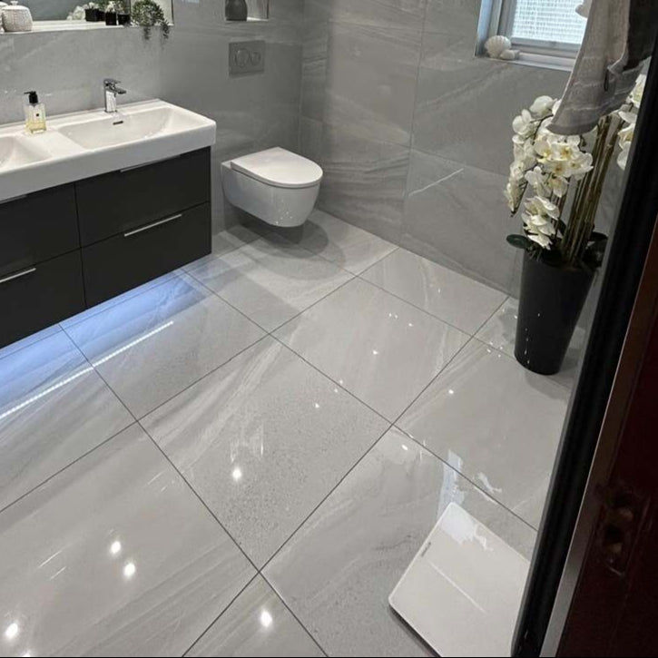 Bathroom walls and floors tiled with Andrea dark grey glosss porcelain tile 