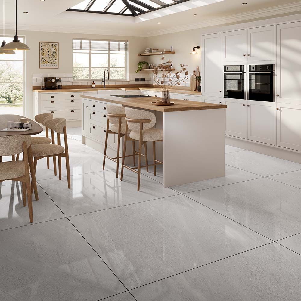 Luxury kitchen featuring large format Andrea light grey gloss porcelain wall and floor tiles with elegant stone-inspired design