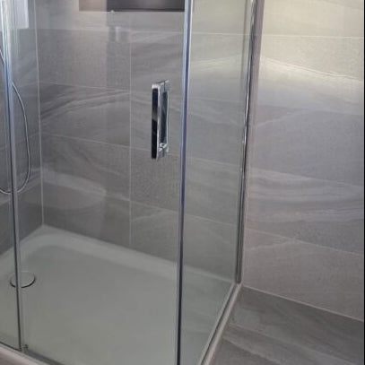 Shower with Andrea light grey matt porcelain floor and wall tile featuring a durable stone-effect finish