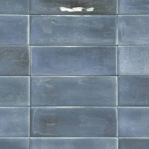 Close up of Atelier blue gloss wall brick shaped tile