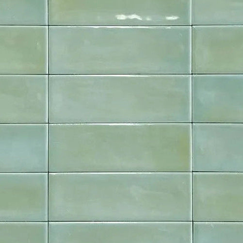 Close up of Atelier green gloss tile with modern brick design for walls and floors