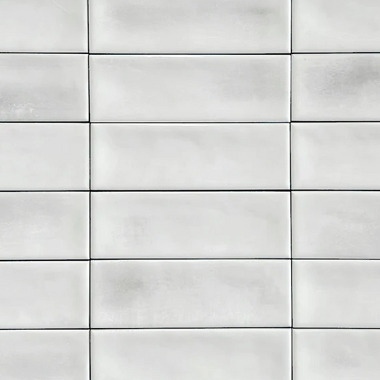 Close up of Atelier white brick wall and floor brick shaped tile 