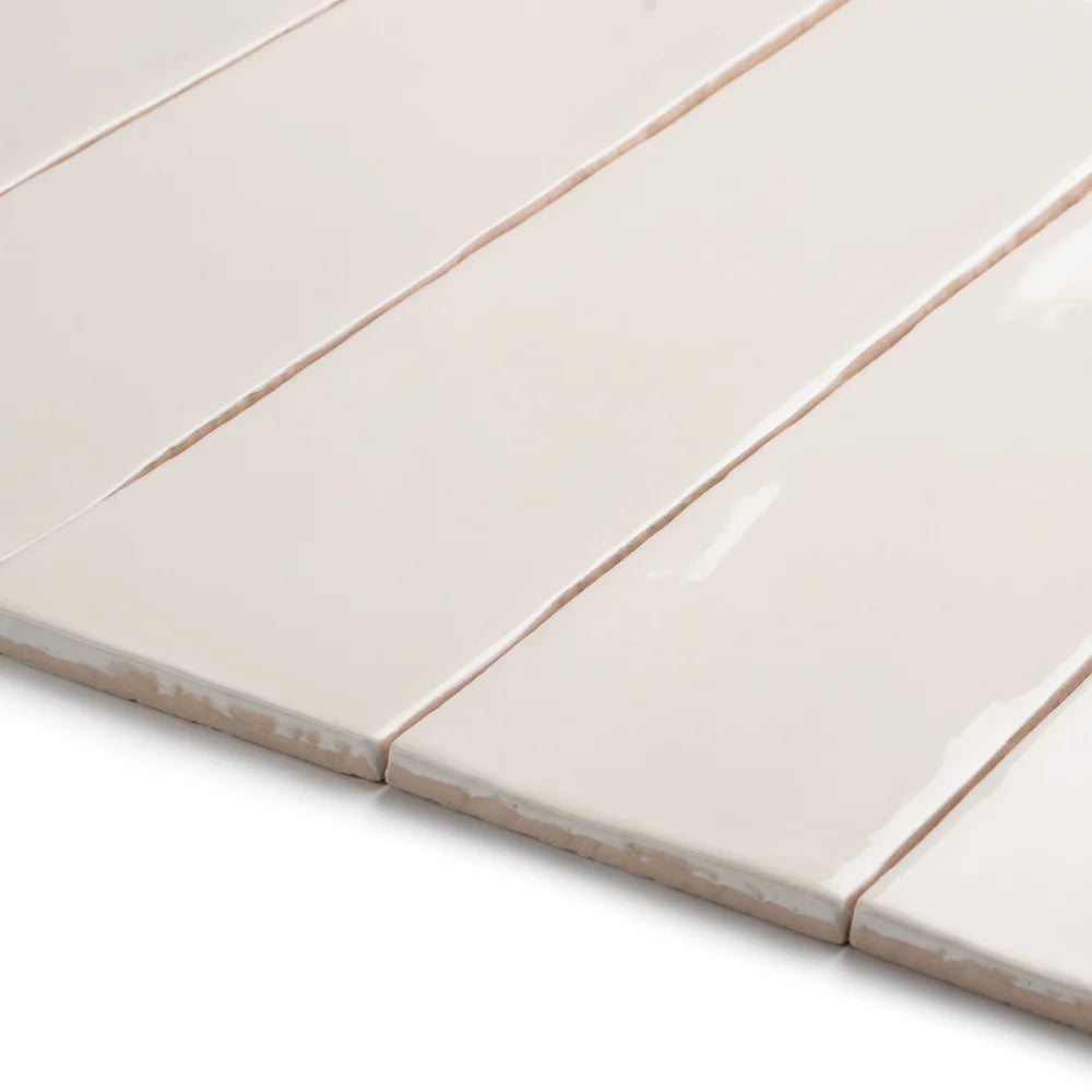 Close-up of bespoke cream rustic gloss ceramic tile