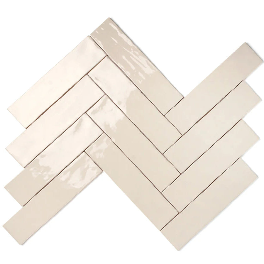 Close-up of Bespoke mushroom rustic ceramic tile laid in herringbone pattern