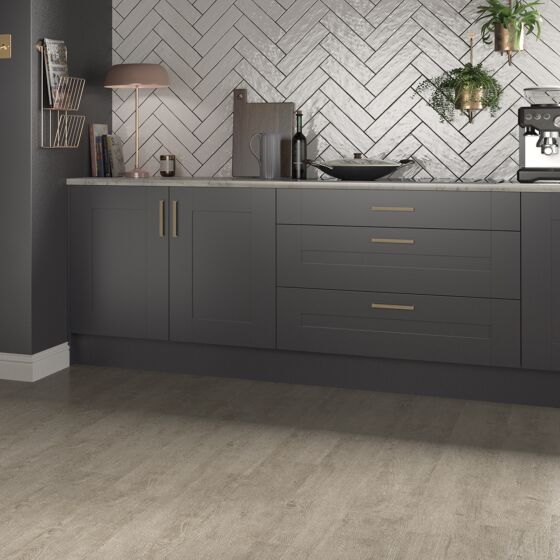 Modern kitchen featuring bespoke white rustic gloss ceramic tiles in herringbone pattern