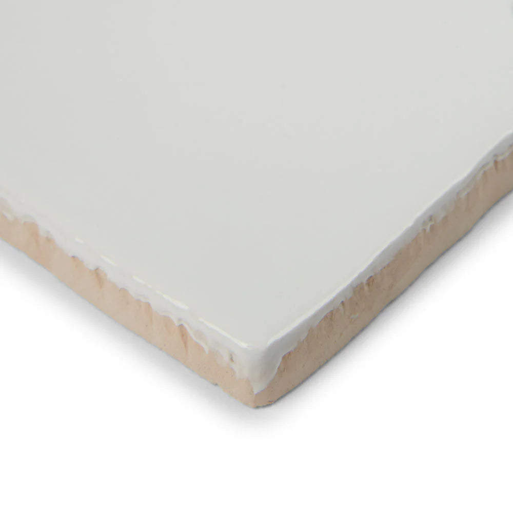 Close-up of bespoke white rustic ceramic wall tile suitable for kitchens and bathrooms