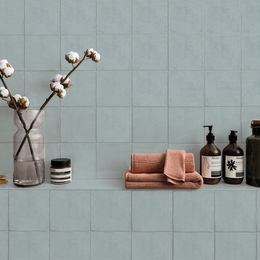 Bathroom featuring Bold blue ceramic wall tile with smooth shiny finish for modern interiors