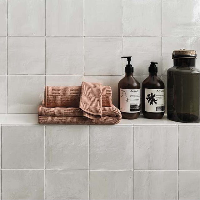 Bathroom featuring Bold white ceramic wall tile with smooth shiny finish for modern interiors