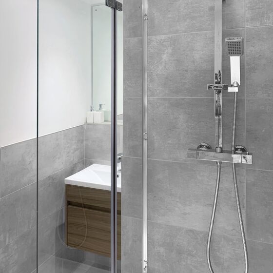 Modern shower featuring Morning ash porcelain wall and floor tile 