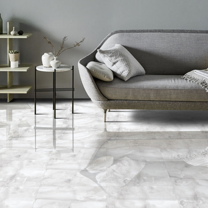 Living room floor tiled with Onyx ice grey gloss marble tile 