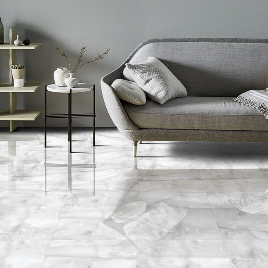 Living room floor tiled with Onyx ice grey gloss marble tile 