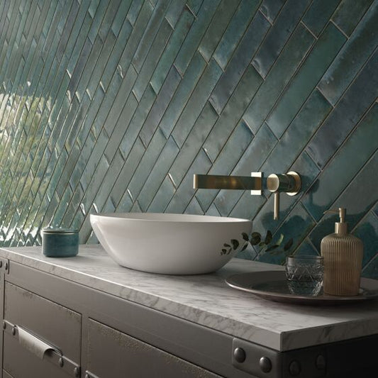 Wish blue gloss brick tiles installed in a contemporary bathroom wall