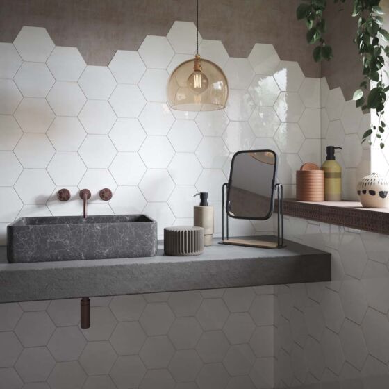 Gloss finish hexagon Wish white wall tiles installed in a luxury bathroom